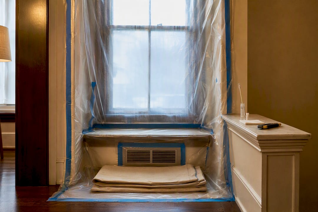 Plastic containment around lead-safe window work